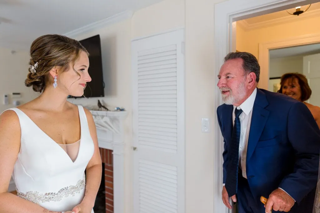 A bride and her dad share a first look