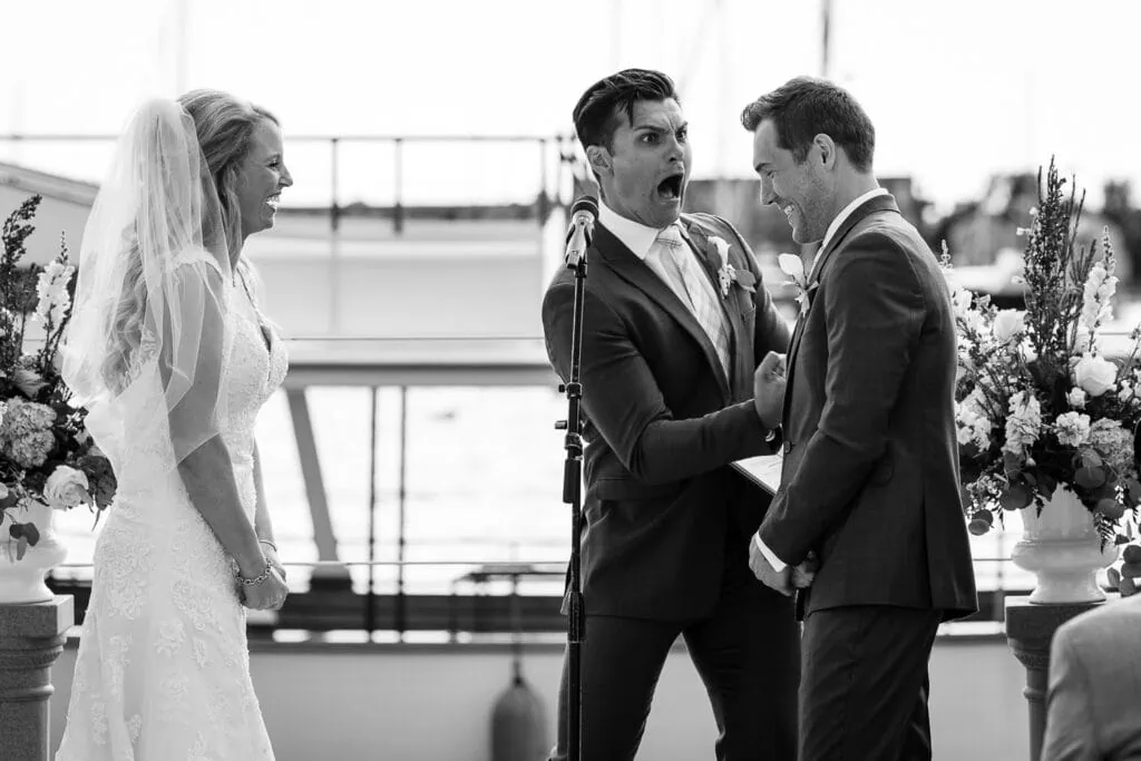 The officiant punching the groom during a wedding ceremony