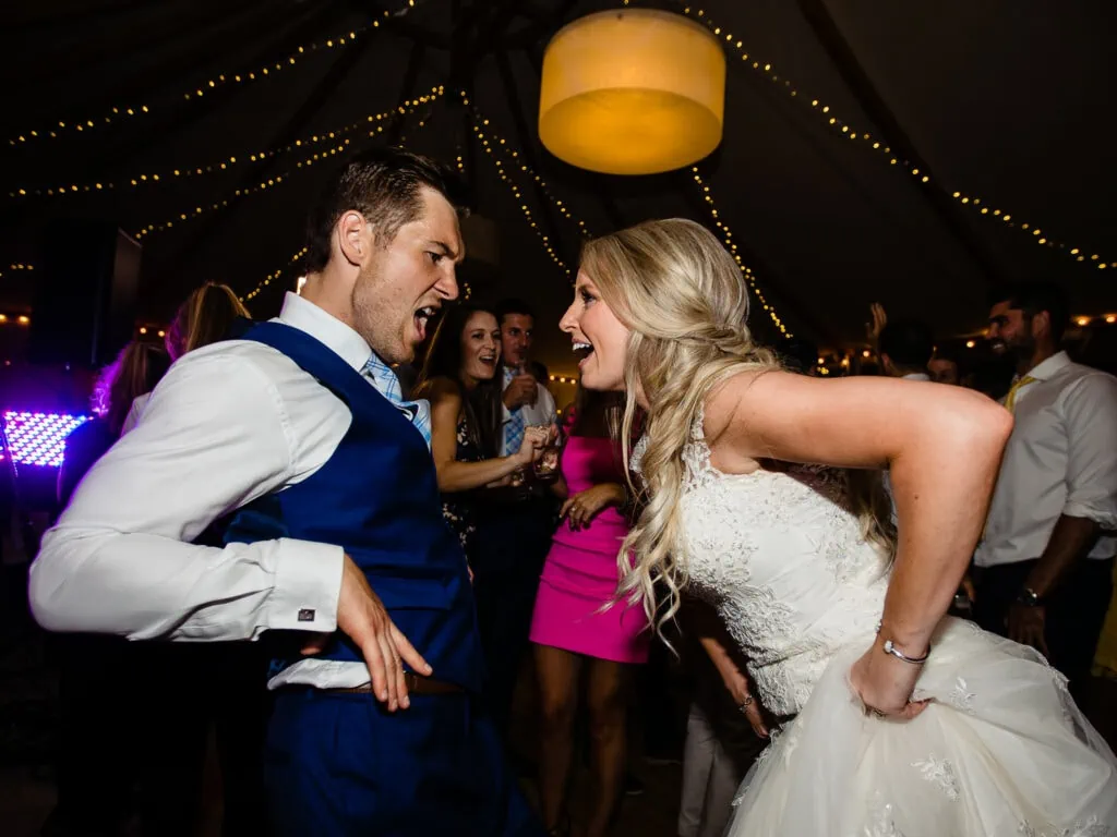 A bride and groom dancing and sing to each other