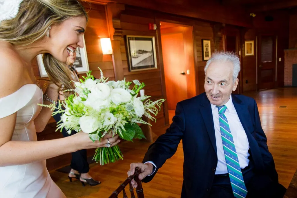 A bride laughing at an older man