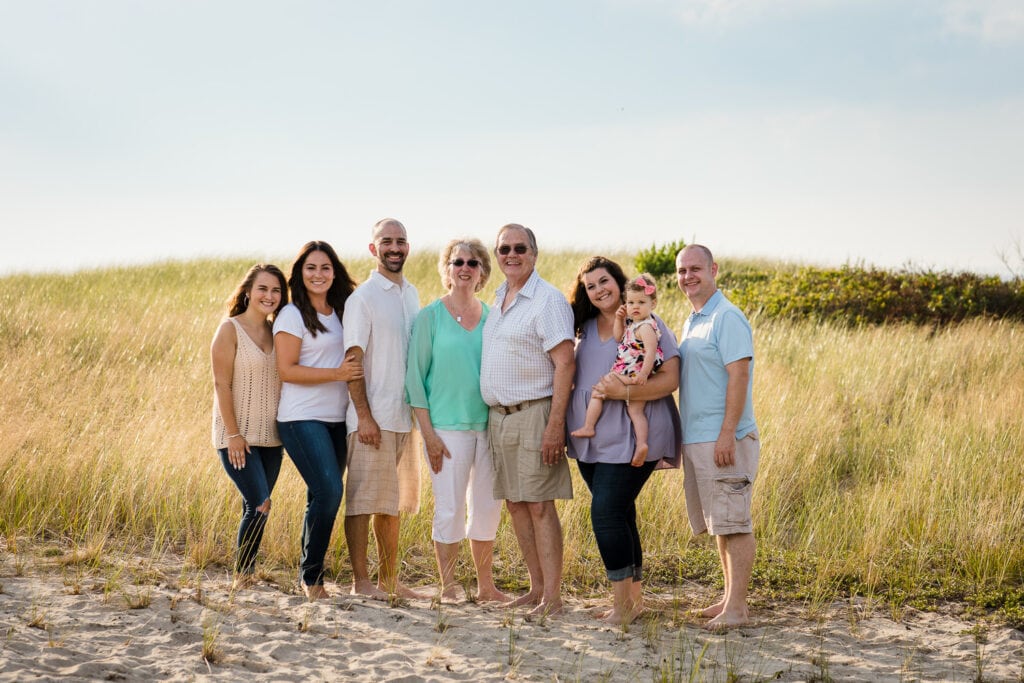 An extended family portrait photo in the dunes at duck harbor in wellfleet ma