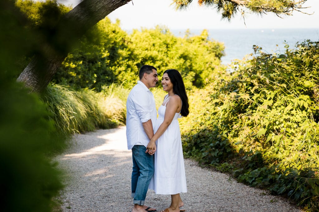 A couple in white at their Watch Hill Rhode Island engagement photo session