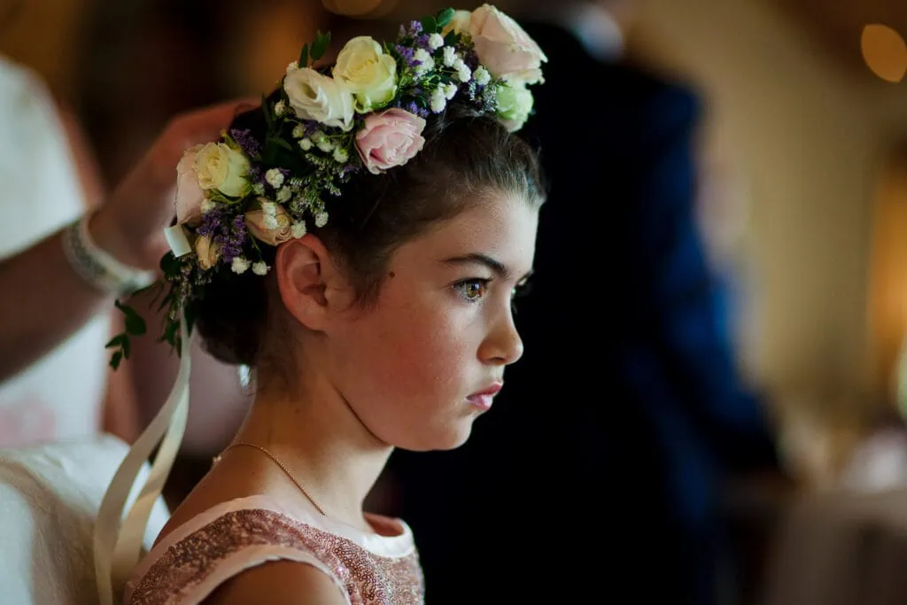 A young girl wearing a flower crown