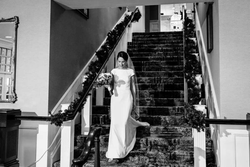 A bride coming down a set of stairs