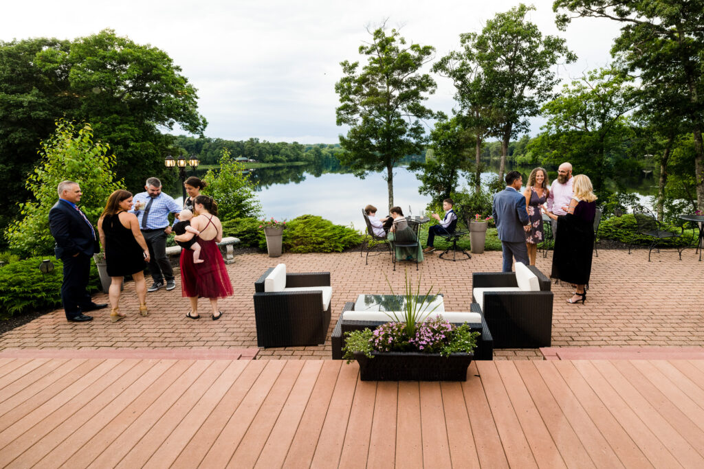 A large patio area overlooking a lake