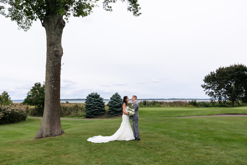 A bride and groom on a golf course