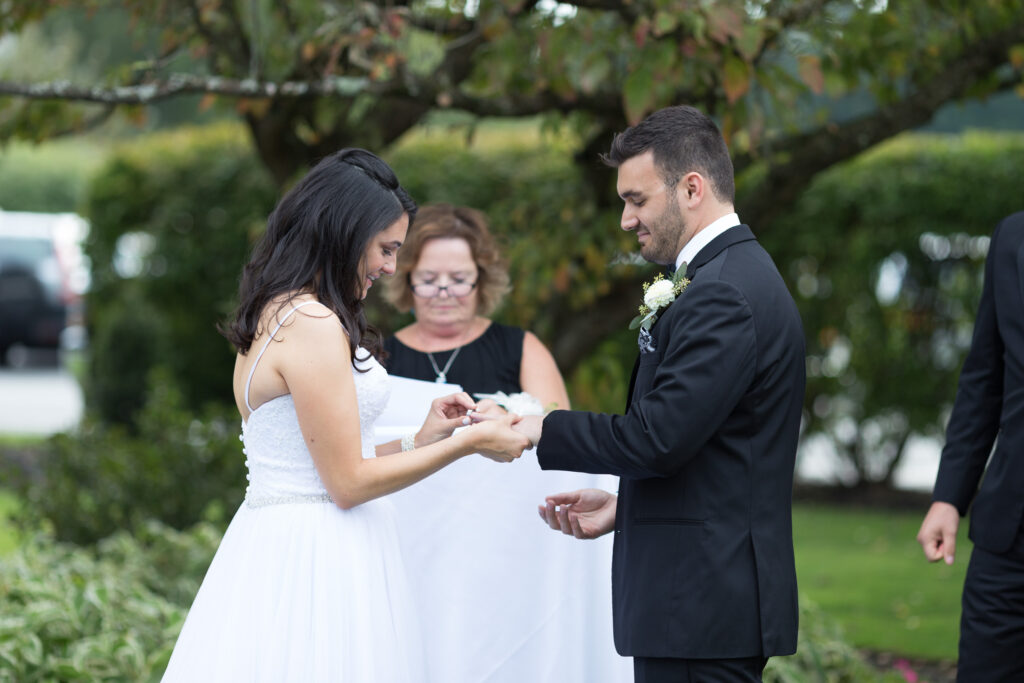 A bride and groom exchanging rings