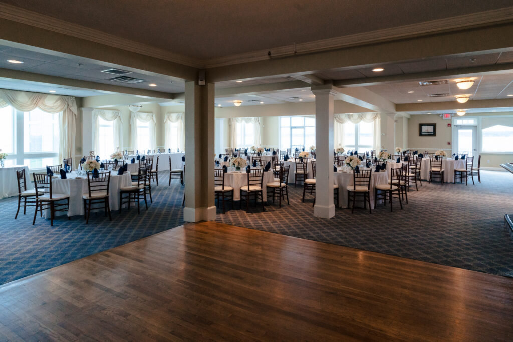Wedding tables setup in a ballroom with a dance floor